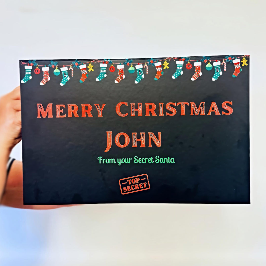 Christmas-themed gift box with 'Merry Christmas John' text and decorative elements.