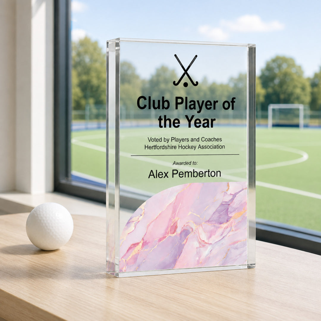 Personalised hockey trophy printed Club Player of the Year with crossed hockey sticks and a pink base