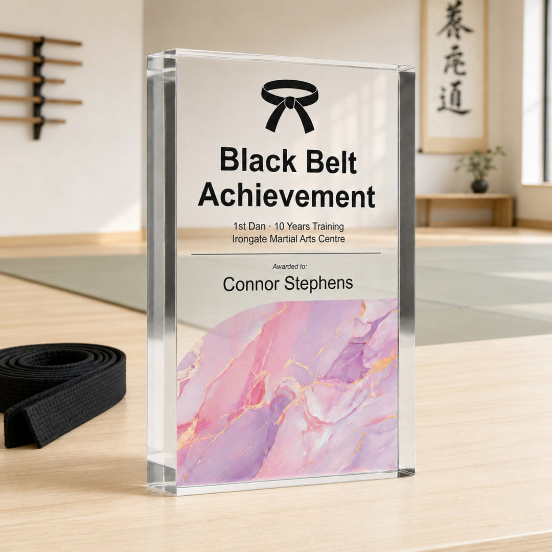 Personalised martial arts trophy printed Black Belt Achievement with a belt icon and pink base