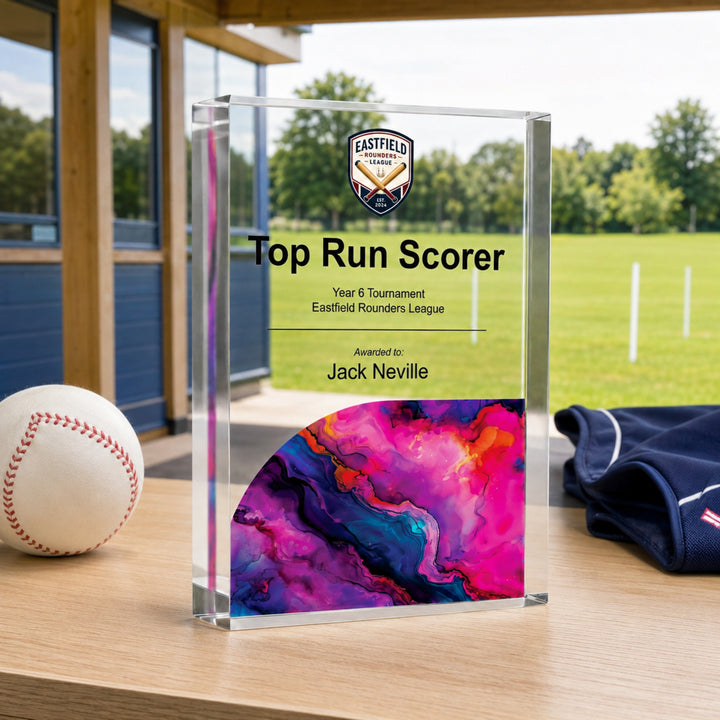 Personalised rounders trophy printed Top Run Scorer with a school crest and magenta base