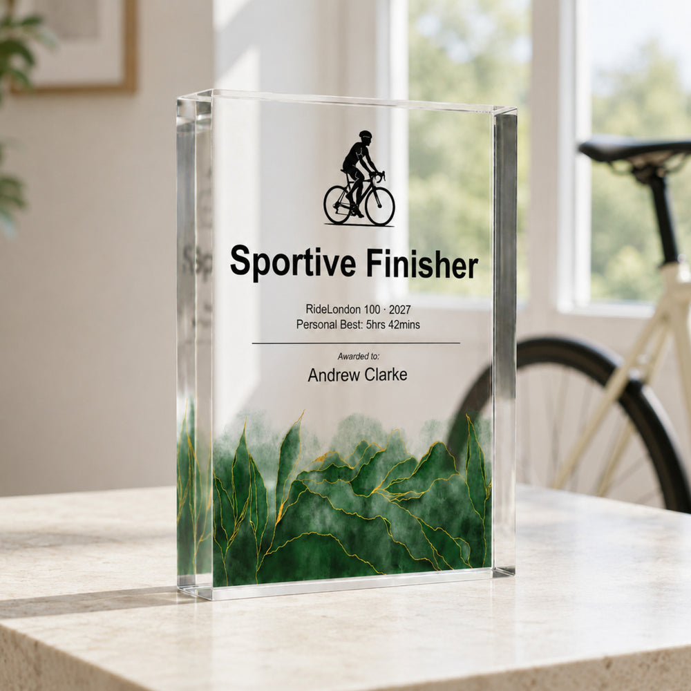 Personalised cycling trophy printed Sportive Finisher with a bicycle icon, beside a road bike
