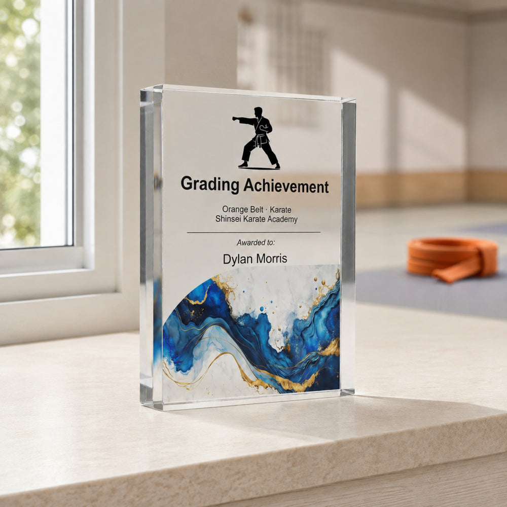 Personalised karate trophy printed Grading Achievement with a karate icon and blue gold base