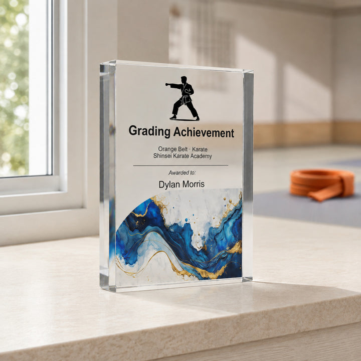 Personalised karate trophy printed Grading Achievement with a karate icon and blue gold base