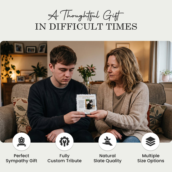 Two people at home holding the paw print memorial stone, a thoughtful sympathy gift