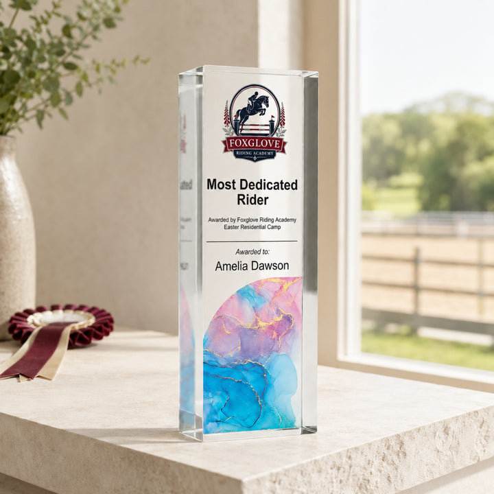 Slim upright personalised equestrian trophy printed Most Dedicated Rider with a riding centre crest