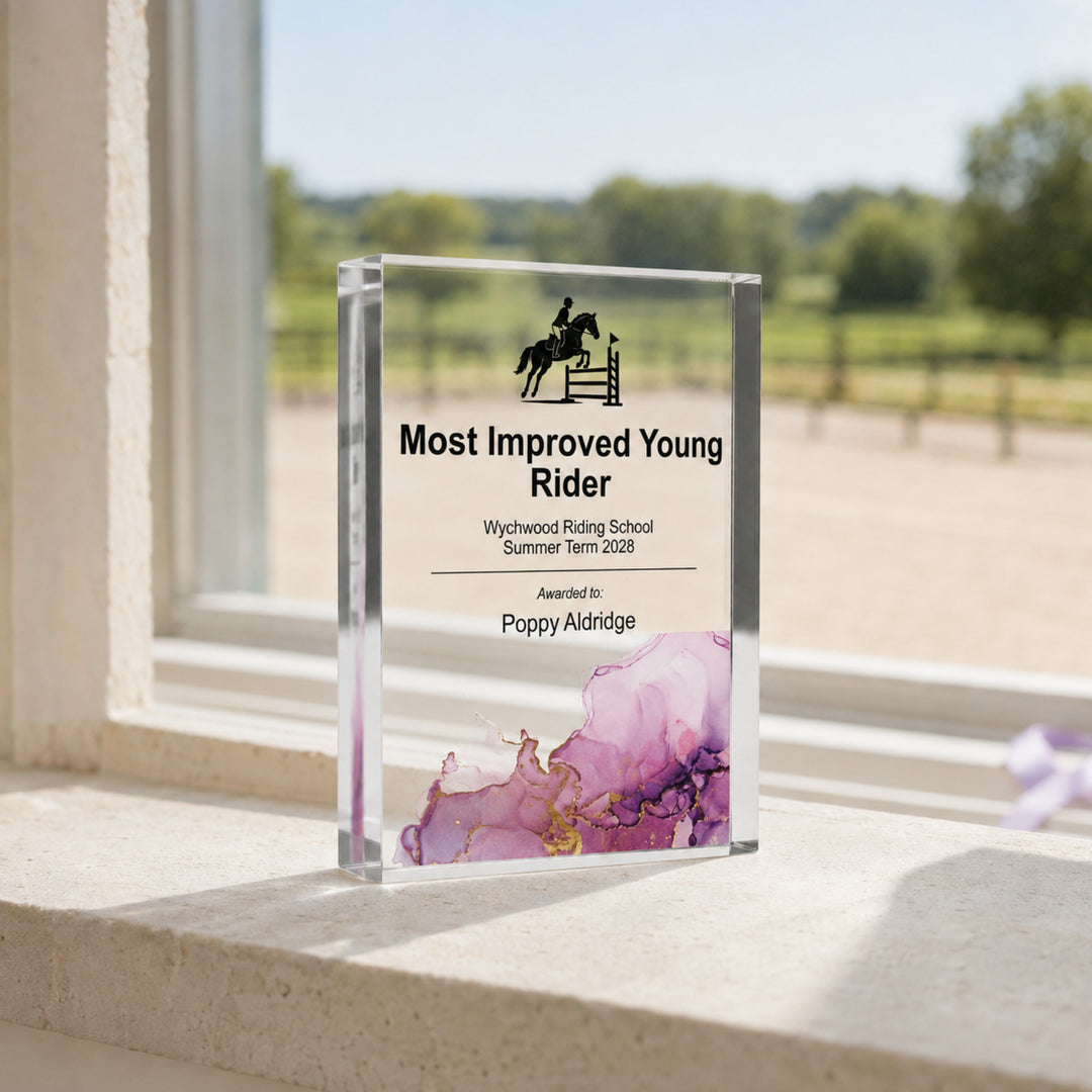 Personalised junior equestrian trophy printed Most Improved Young Rider for a riding school