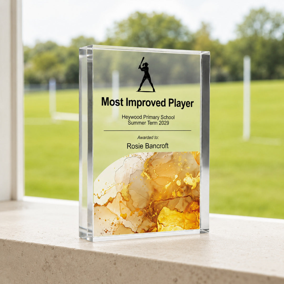 Personalised rounders trophy printed Most Improved Player with a batter icon and amber base