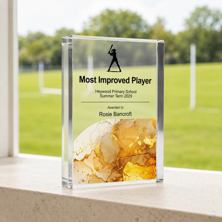Personalised rounders trophy printed Most Improved Player with a batter icon and amber base