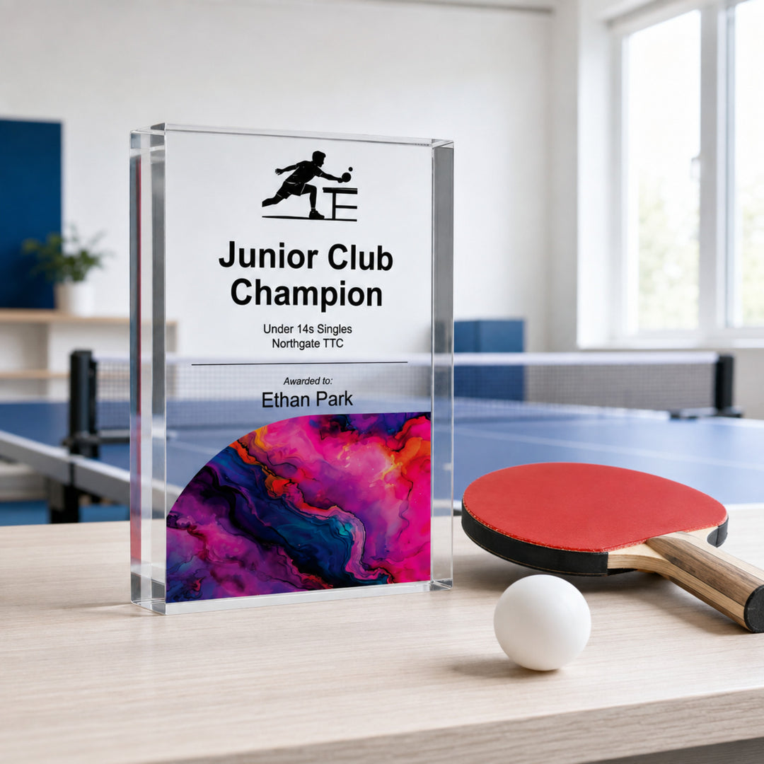 Personalised junior table tennis trophy printed Junior Club Champion beside a bat and ball