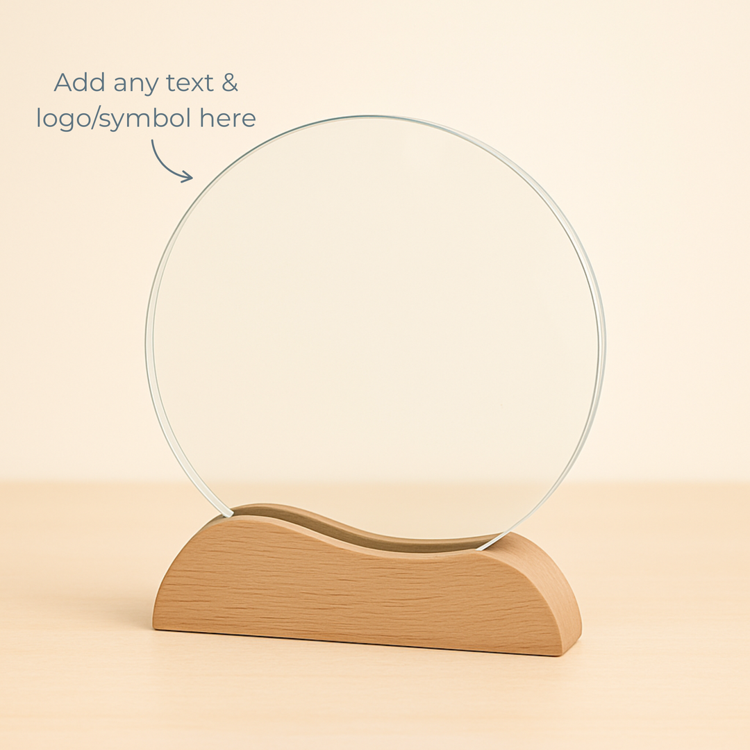 Clear crystal glass award on a wooden base