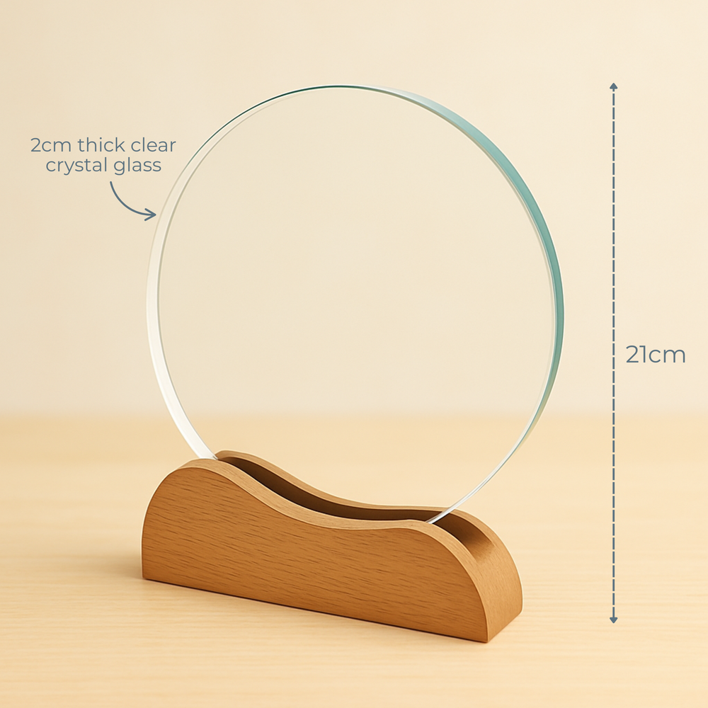 Clear crystal glass circle award on a wooden stand with measurements indicated