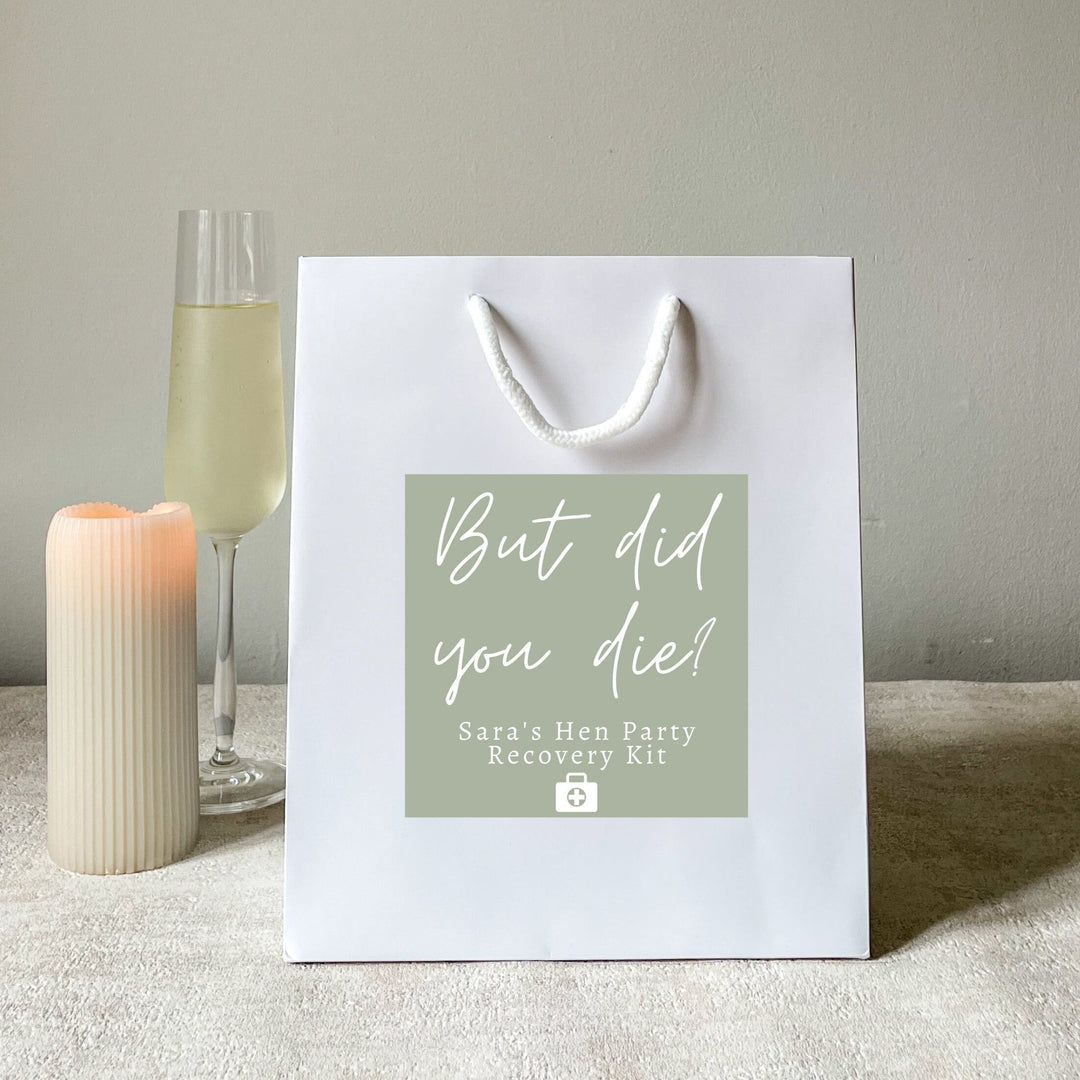 A white color hen party gift bags with the stickers
