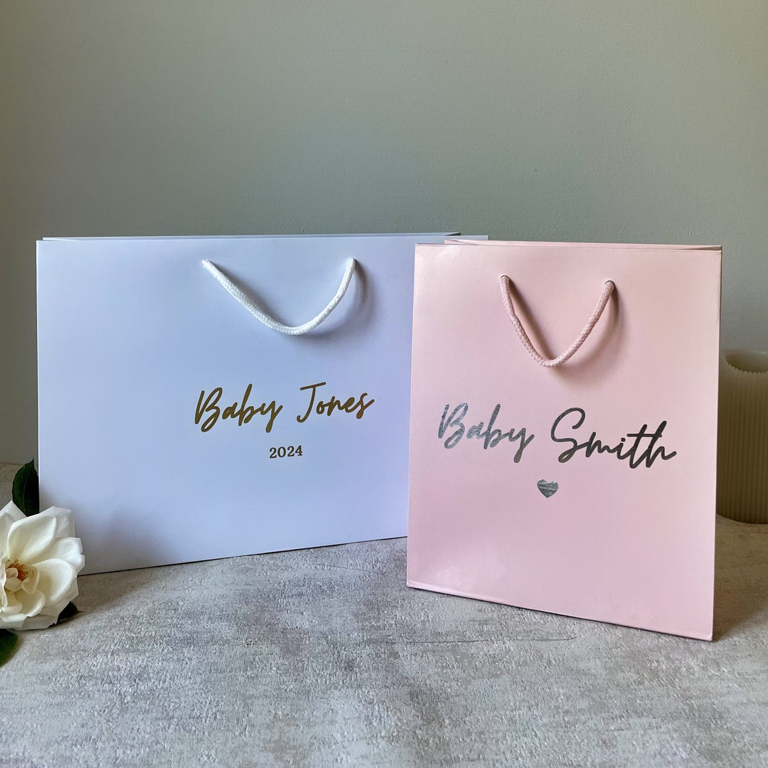white and pink colors with two different sizes new baby gift bag
