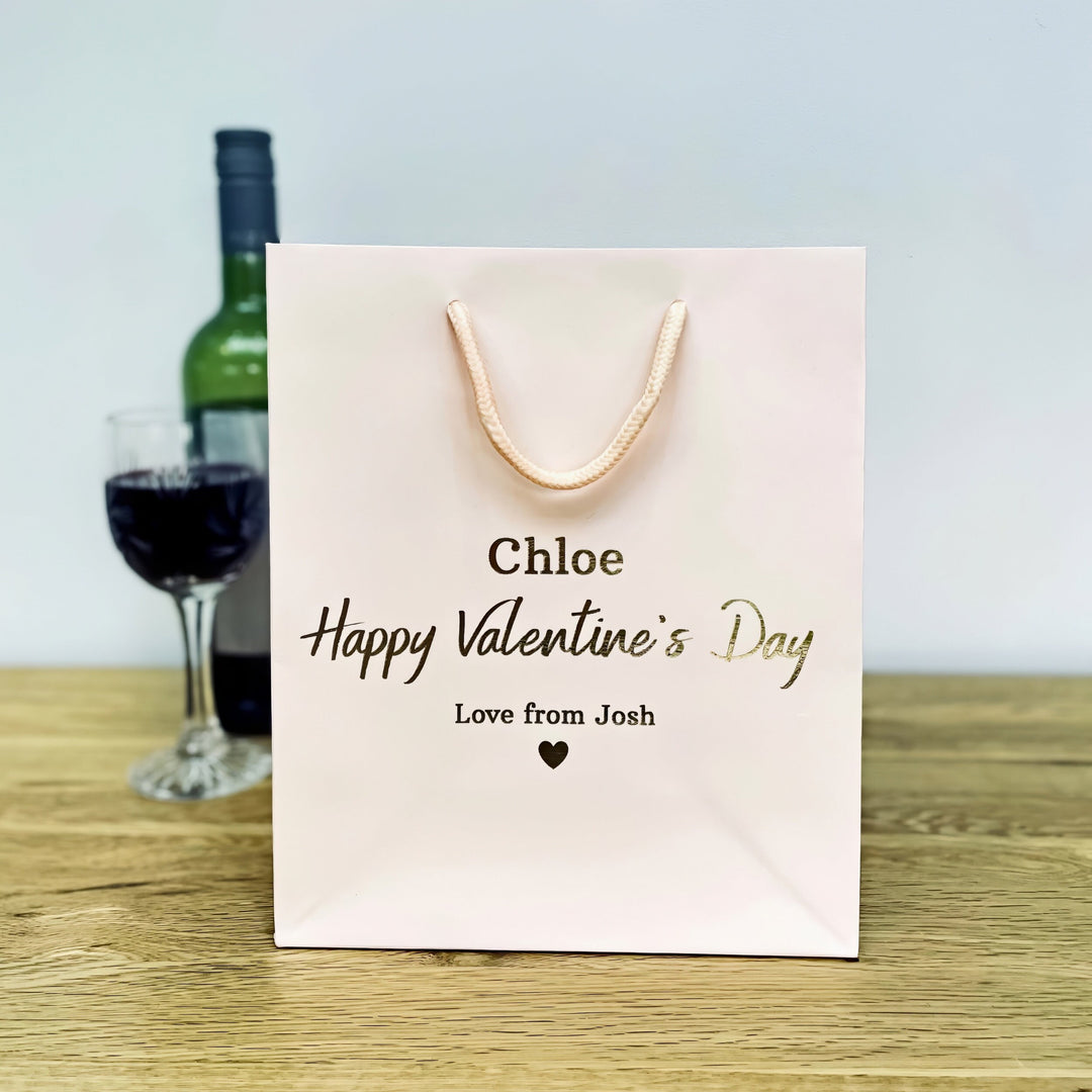 A kight pink valentine gift bags with "chole happy valentine's Day"